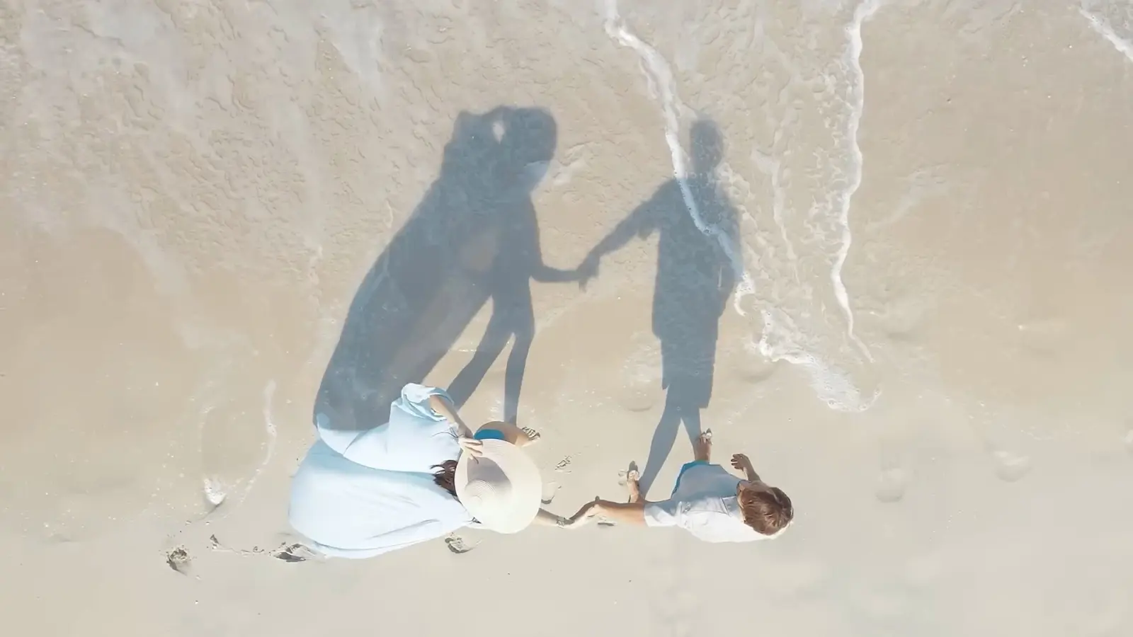 Aerial still of a family on the sand at Saadiyat beach